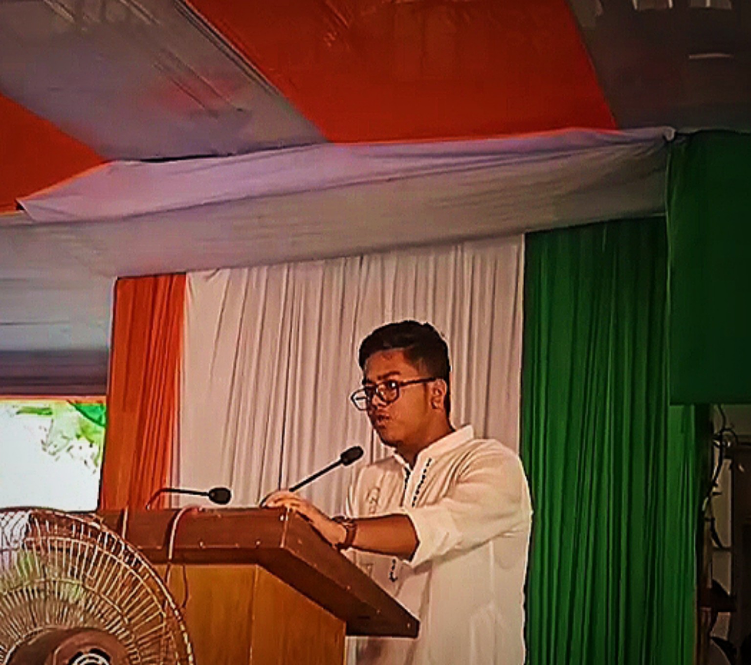 Asif speaking on stage